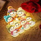 Personalized snowman family light box lit up in a cozy room