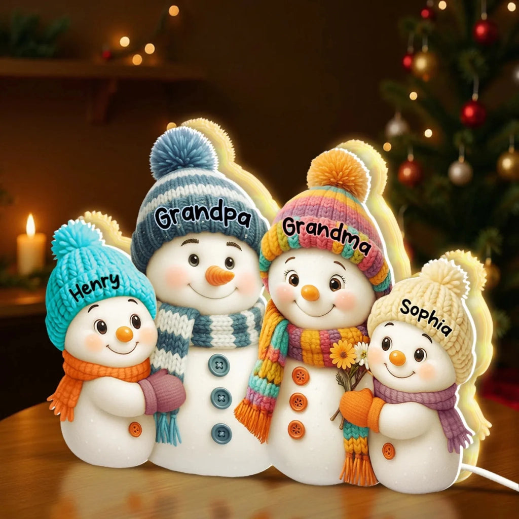 Snowman family light box with grandparents and grandkids' names, lit scene