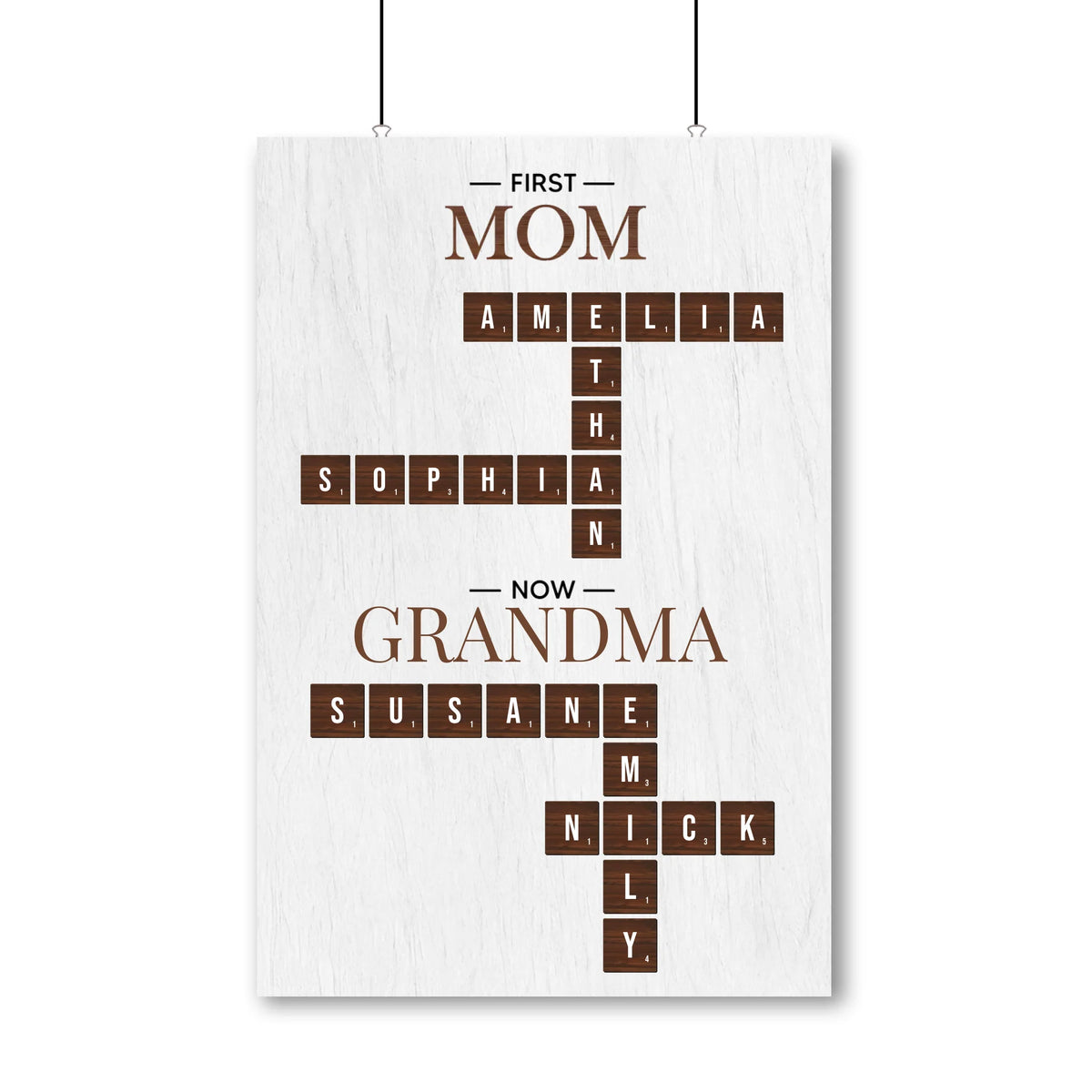Personalized crossword poster reading First Mom Now Grandma with the family's names crossing each other